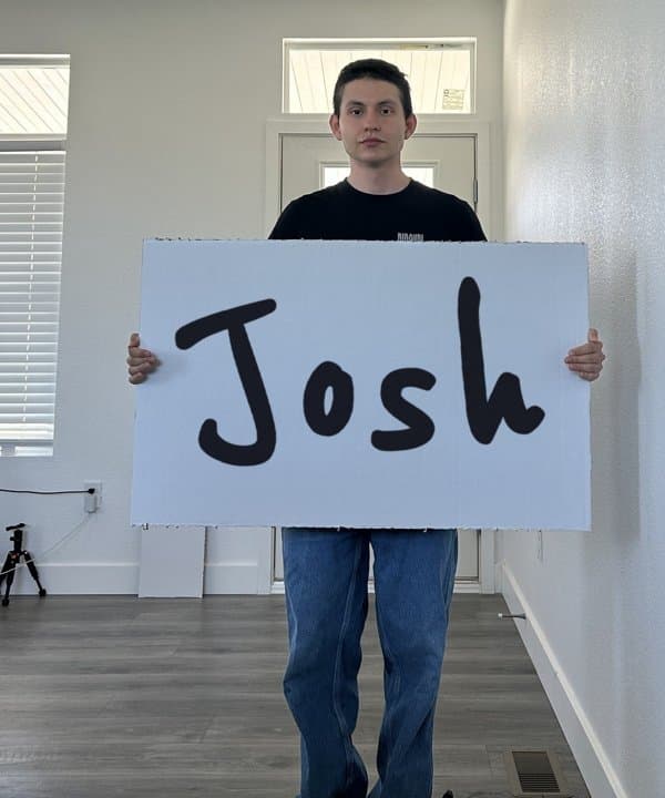 Review text with a crew member holding a sign with the customer's name, Josh